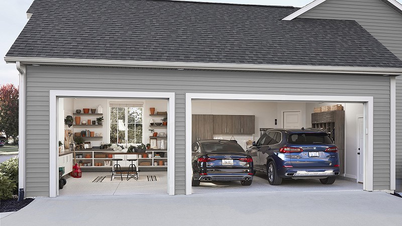 3 car garage with 2 cars in the garage